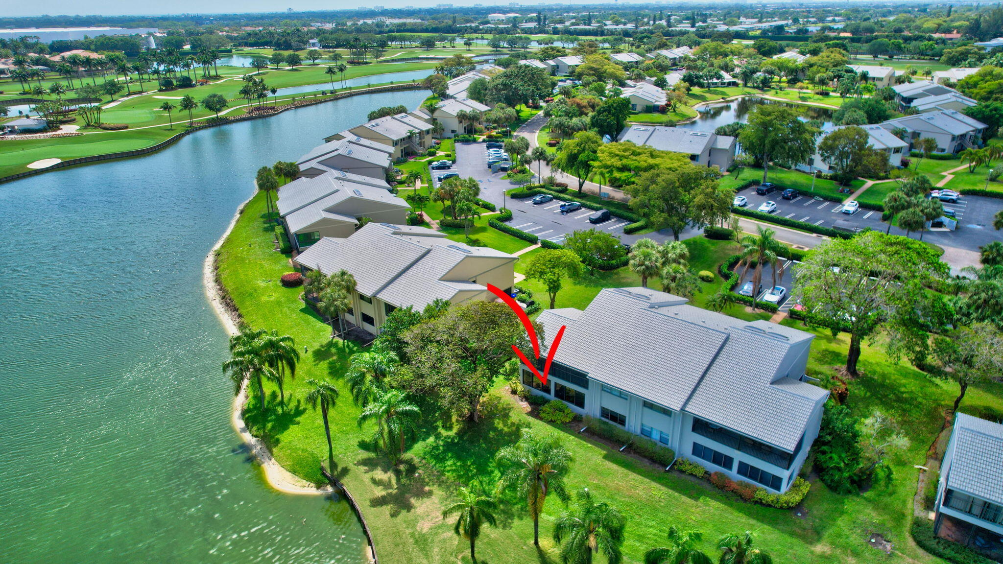 27 Eastgate Drive, Unit C Boynton Beach, FL 33436 - Photo 52 of 87 an aerial view of a house with a garden and lake view