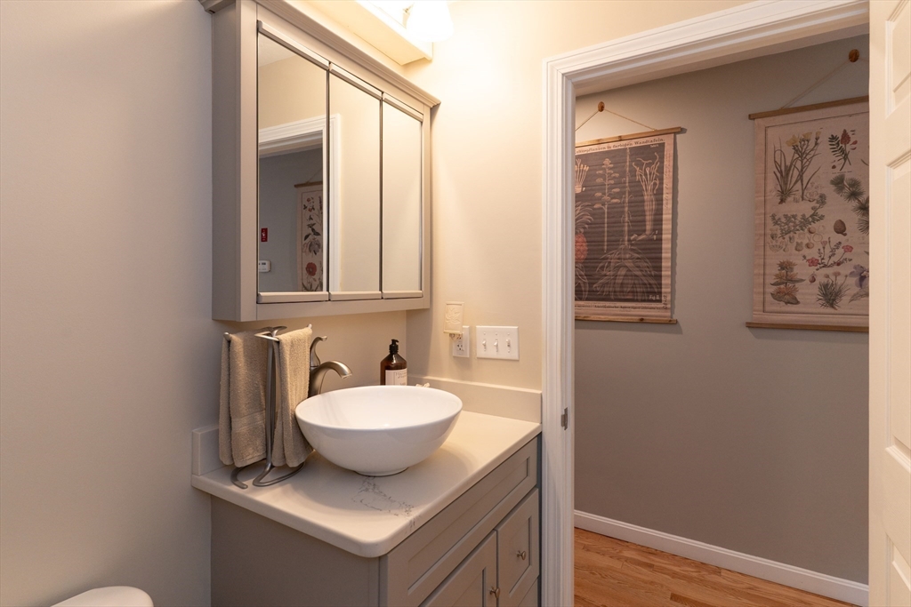1 Leno Road Holland, MA 01521 - Photo 17 of 40 a bathroom with a sink and mirror with toilet