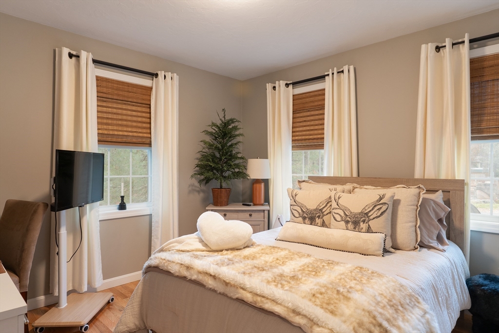 1 Leno Road Holland, MA 01521 - Photo 18 of 40 a bedroom with a large bed and a window