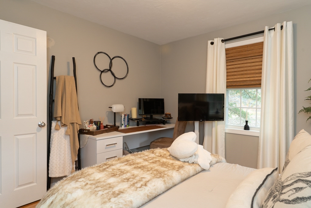 1 Leno Road Holland, MA 01521 - Photo 20 of 40 a bedroom with a bed and a flat screen tv
