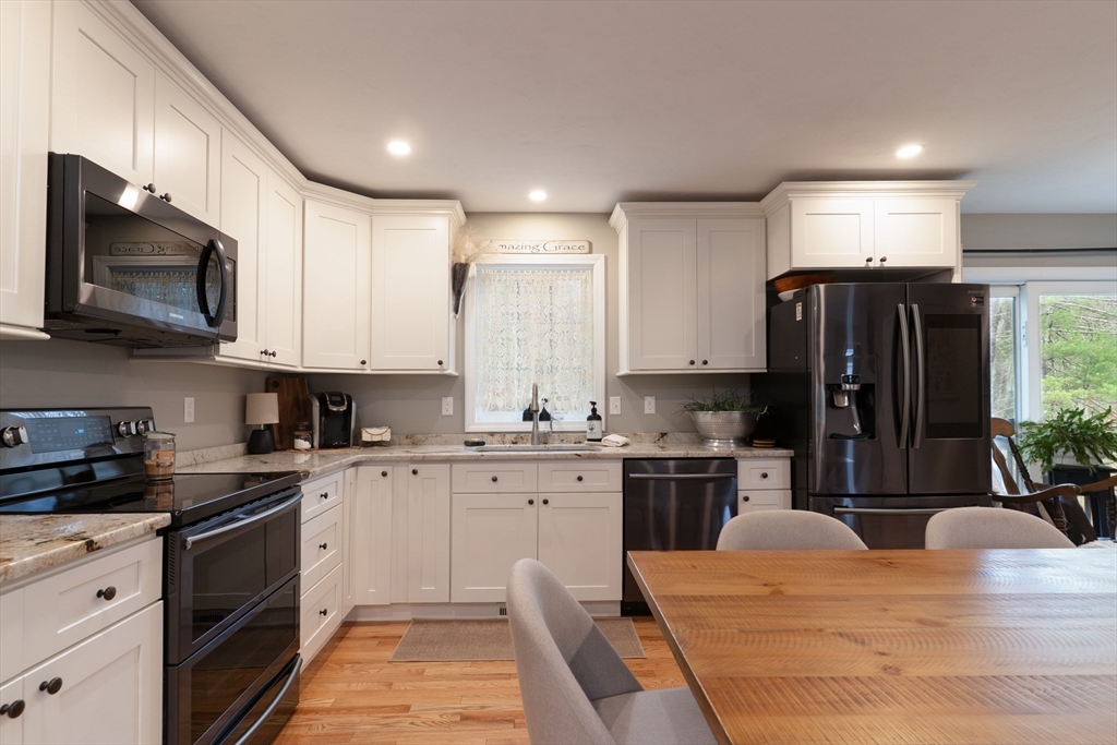 1 Leno Road Holland, MA 01521 - Photo 10 of 40 a kitchen with stainless steel appliances granite countertop a refrigerator stove microwave and sink