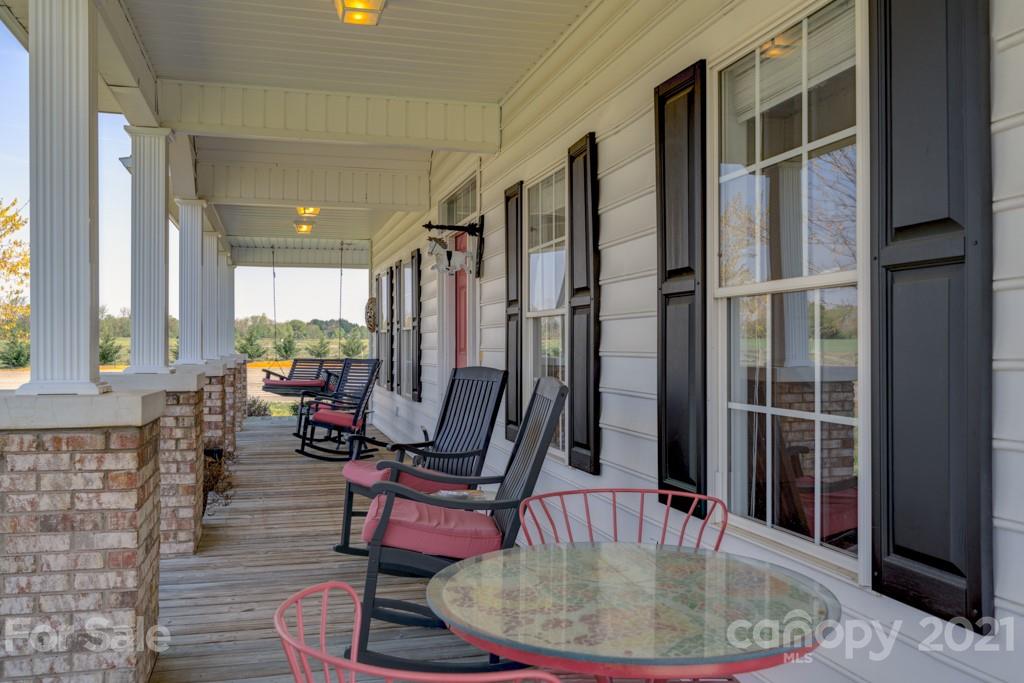 1481 Airport Road Rutherfordton, NC 28139 - Photo 19 of 47 a room with lots of furniture and windows