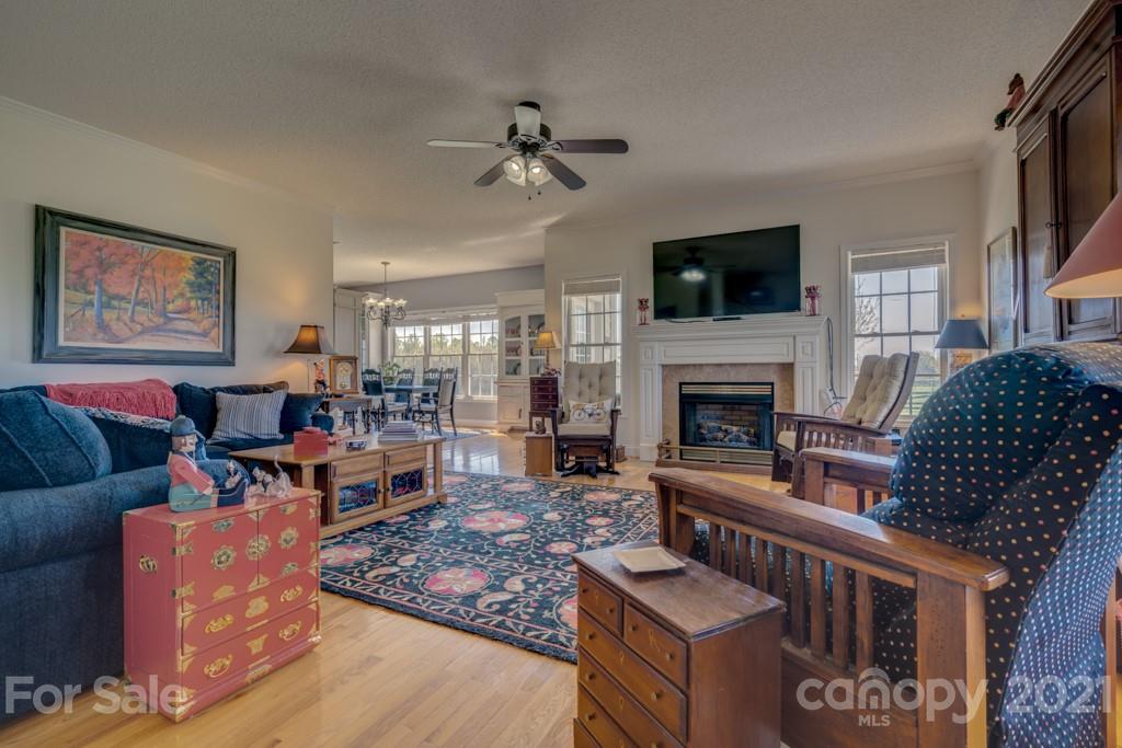 1481 Airport Road Rutherfordton, NC 28139 - Photo 21 of 47 a living room with furniture a flat screen tv and a fireplace