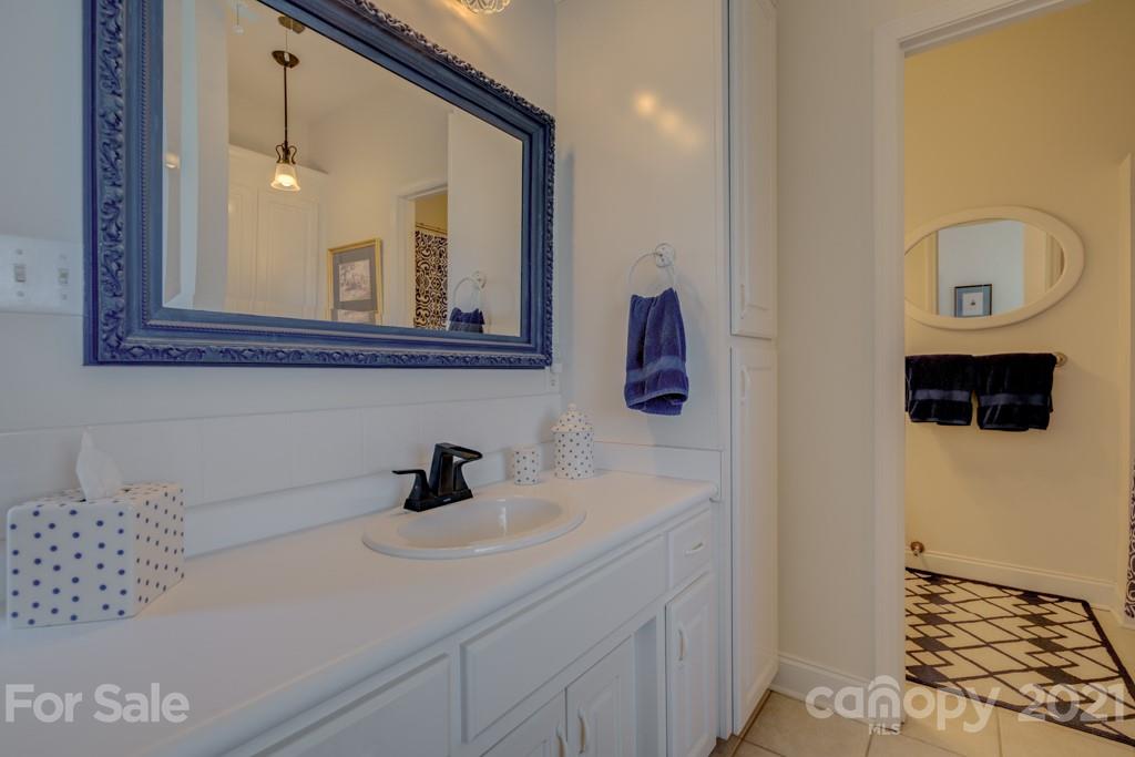 1481 Airport Road Rutherfordton, NC 28139 - Photo 36 of 47 a bathroom with a sink a toilet and mirror