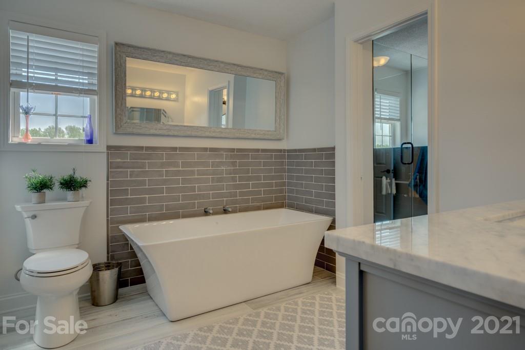 1481 Airport Road Rutherfordton, NC 28139 - Photo 40 of 47 a bathroom with a toilet a sink and bathtub