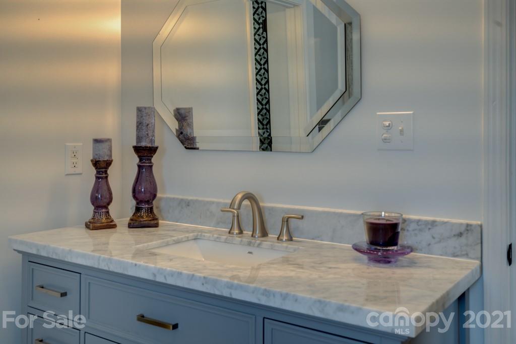 1481 Airport Road Rutherfordton, NC 28139 - Photo 41 of 47 a bathroom with a sink and a mirror