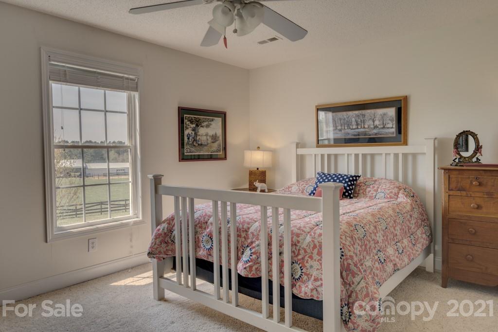 1481 Airport Road Rutherfordton, NC 28139 - Photo 44 of 47 a bed sitting in a bedroom next to a window