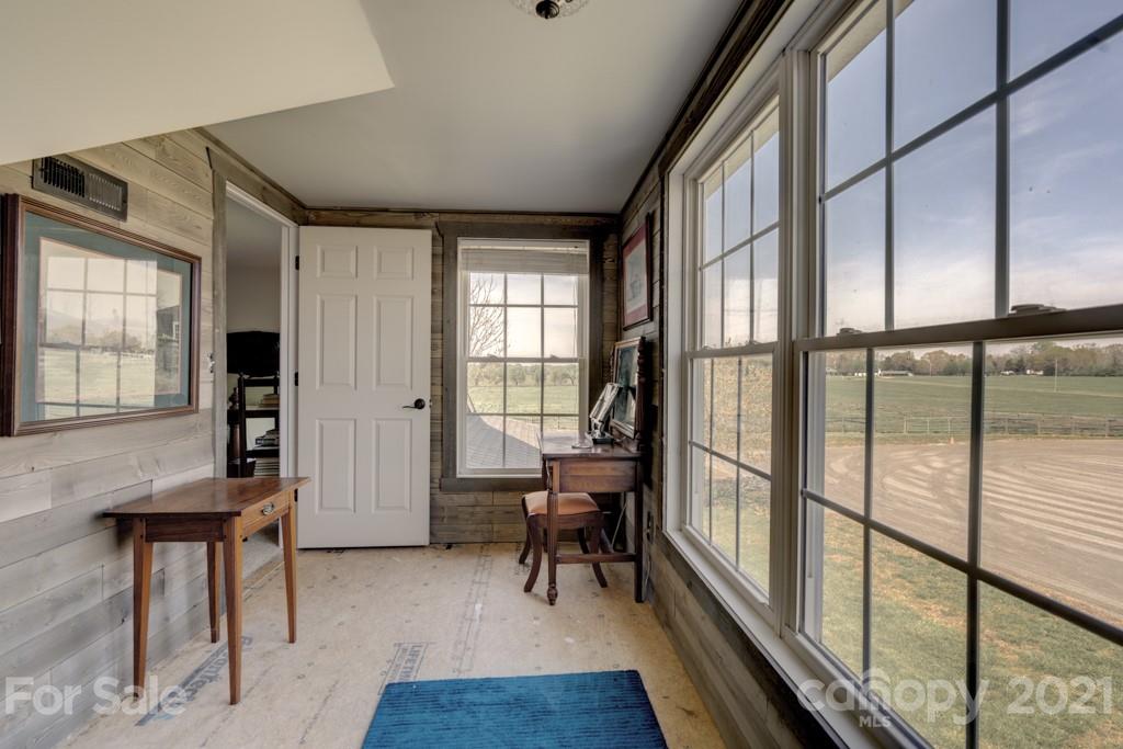 1481 Airport Road Rutherfordton, NC 28139 - Photo 46 of 47 a view of a hallway with furniture and floor to ceiling window