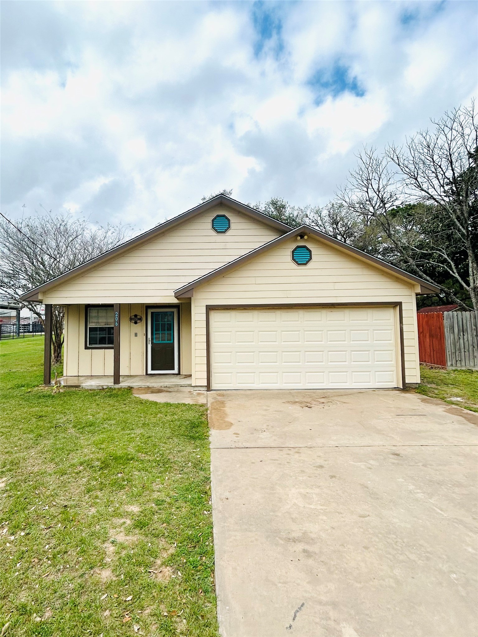 206 Milentz Street Columbus, TX 78934 - Photo 2 of 10 a front view of house with yard and trees