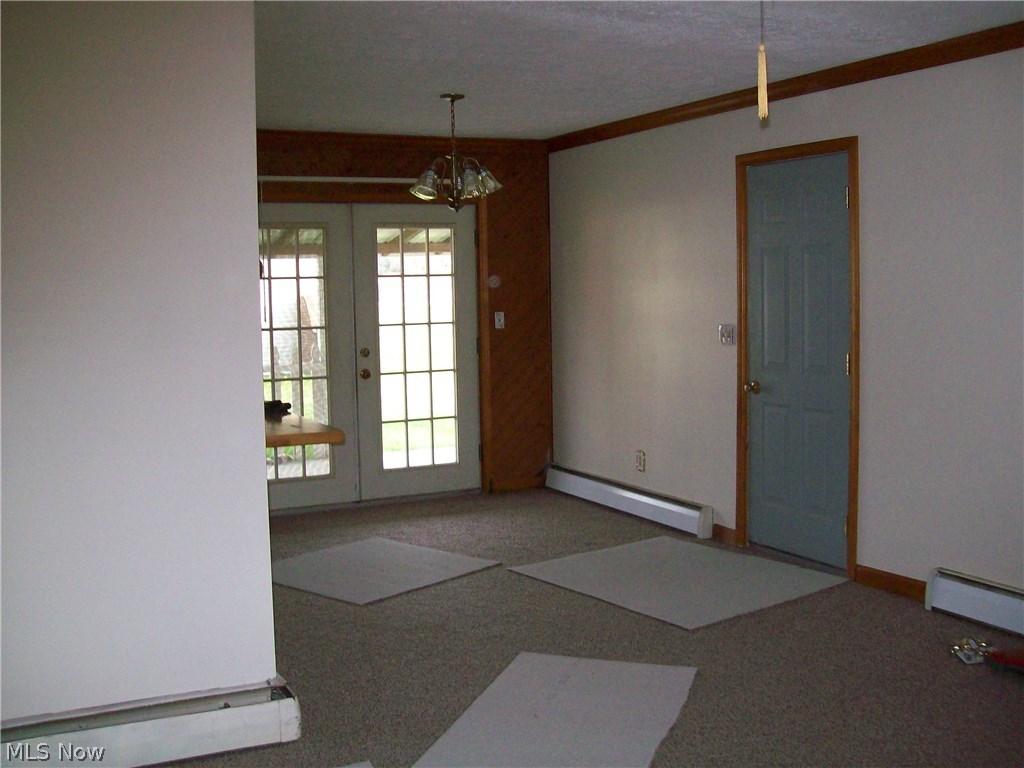 167 Fairview Road Geneva, OH 44041 - Photo 7 of 35 Dining room with the French doors. Door to the right leads to the Garage. .
