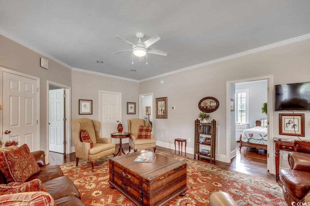 5517 Tranquil Road Conway, SC 29527 - Photo 12 of 39 Living room with crown molding, hardwood / wood-st