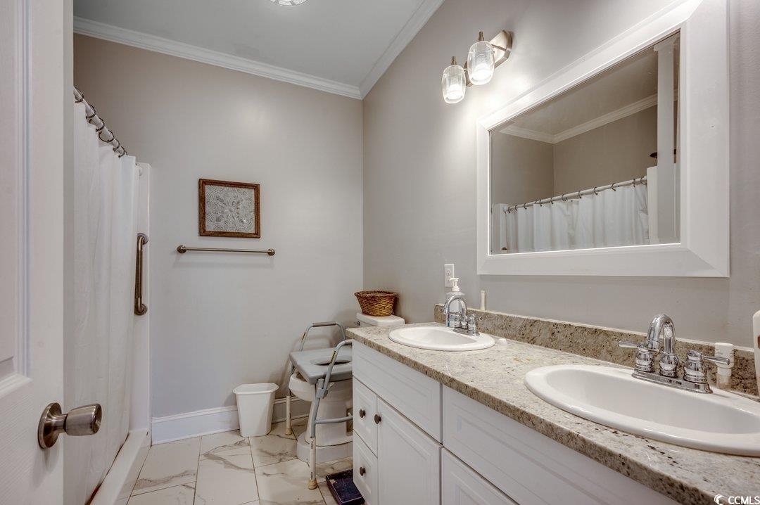 5517 Tranquil Road Conway, SC 29527 - Photo 17 of 39 Bathroom featuring vanity and ornamental molding