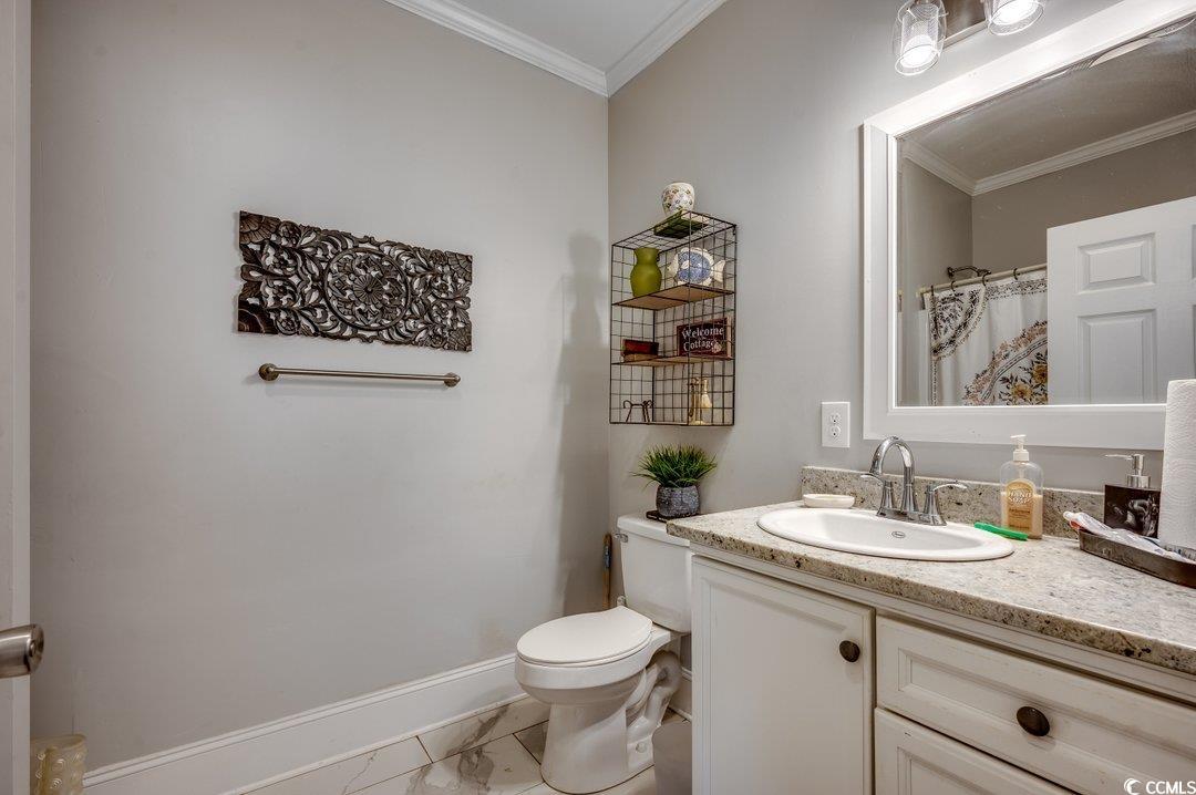 5517 Tranquil Road Conway, SC 29527 - Photo 18 of 39 Bathroom with ornamental molding, vanity, and toil