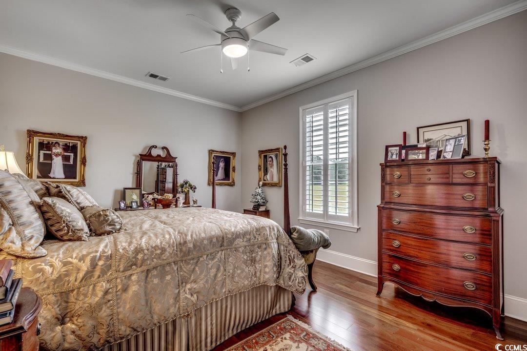 5517 Tranquil Road Conway, SC 29527 - Photo 19 of 39 Bedroom featuring ceiling fan, hardwood / wood-sty
