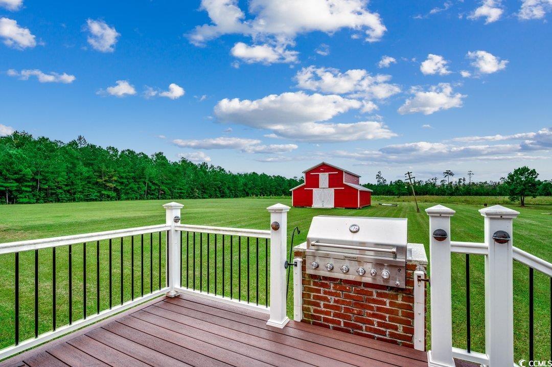 5517 Tranquil Road Conway, SC 29527 - Photo 22 of 39 Deck with a grill, a lawn, and an outdoor kitchen