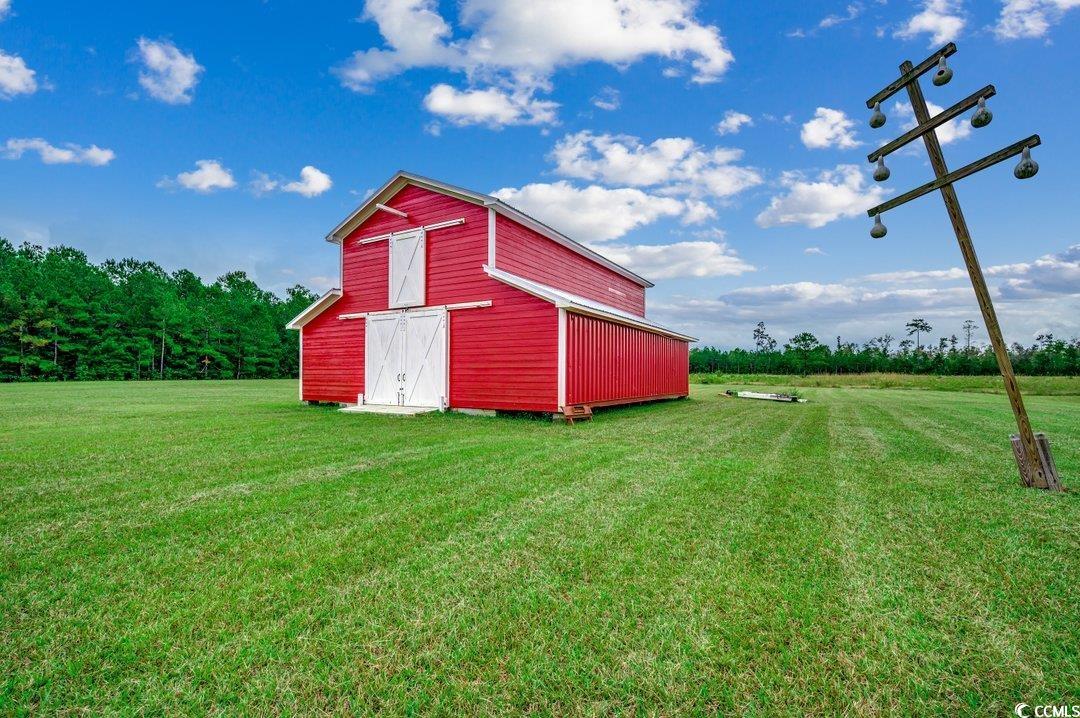 5517 Tranquil Road Conway, SC 29527 - Photo 28 of 39 View of outbuilding featuring a yard