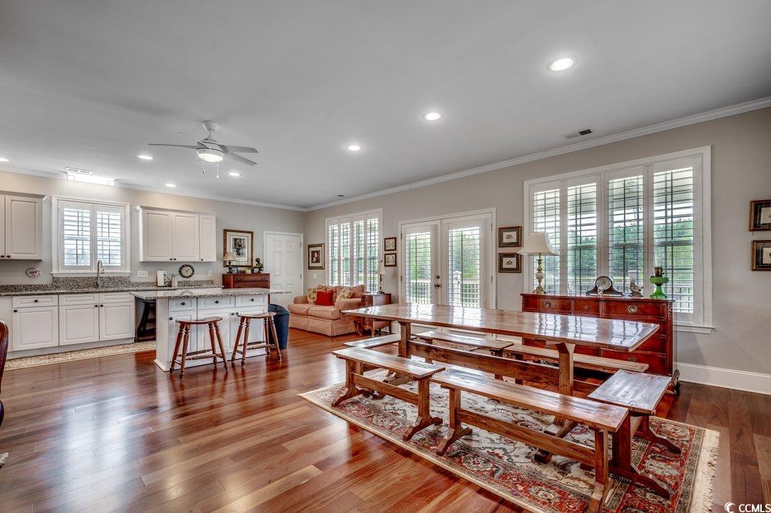 5517 Tranquil Road Conway, SC 29527 - Photo 3 of 39 Dining space with crown molding, dark hardwood / w