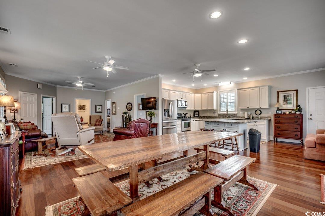 5517 Tranquil Road Conway, SC 29527 - Photo 5 of 39 Dining area with ornamental molding, light wood-ty