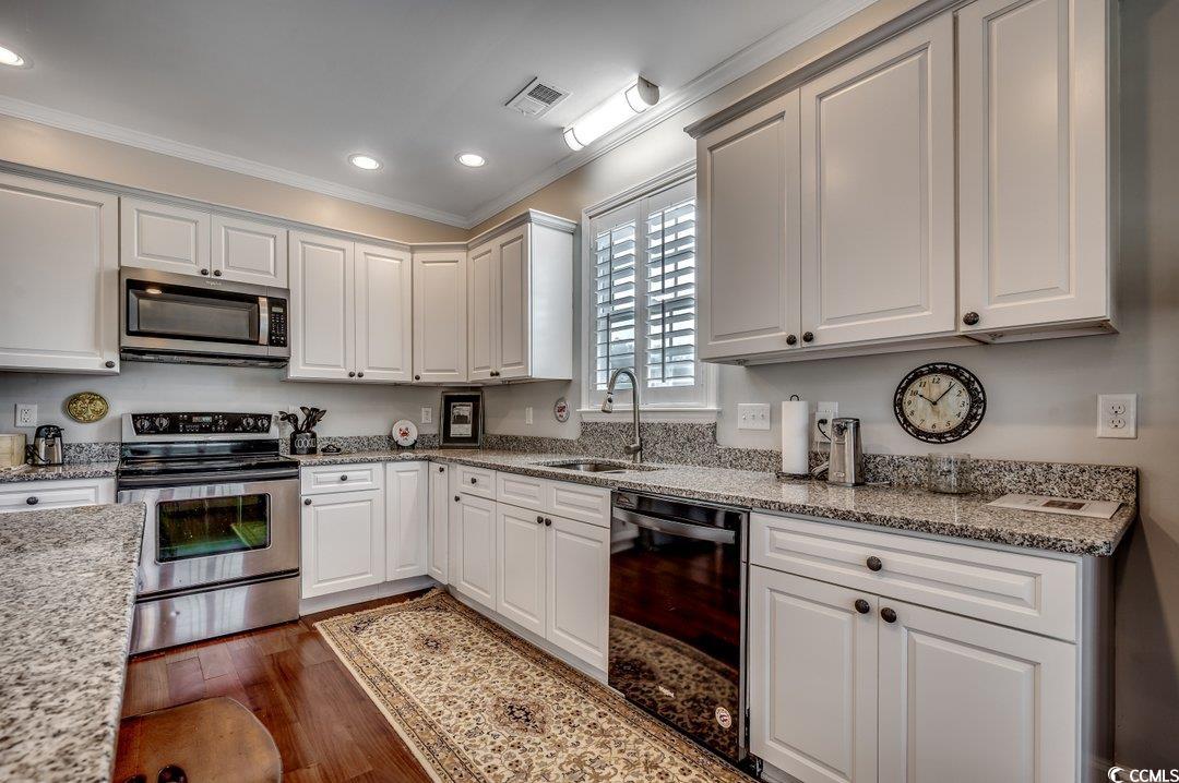 5517 Tranquil Road Conway, SC 29527 - Photo 7 of 39 Kitchen featuring dark wood-type flooring, sink, w