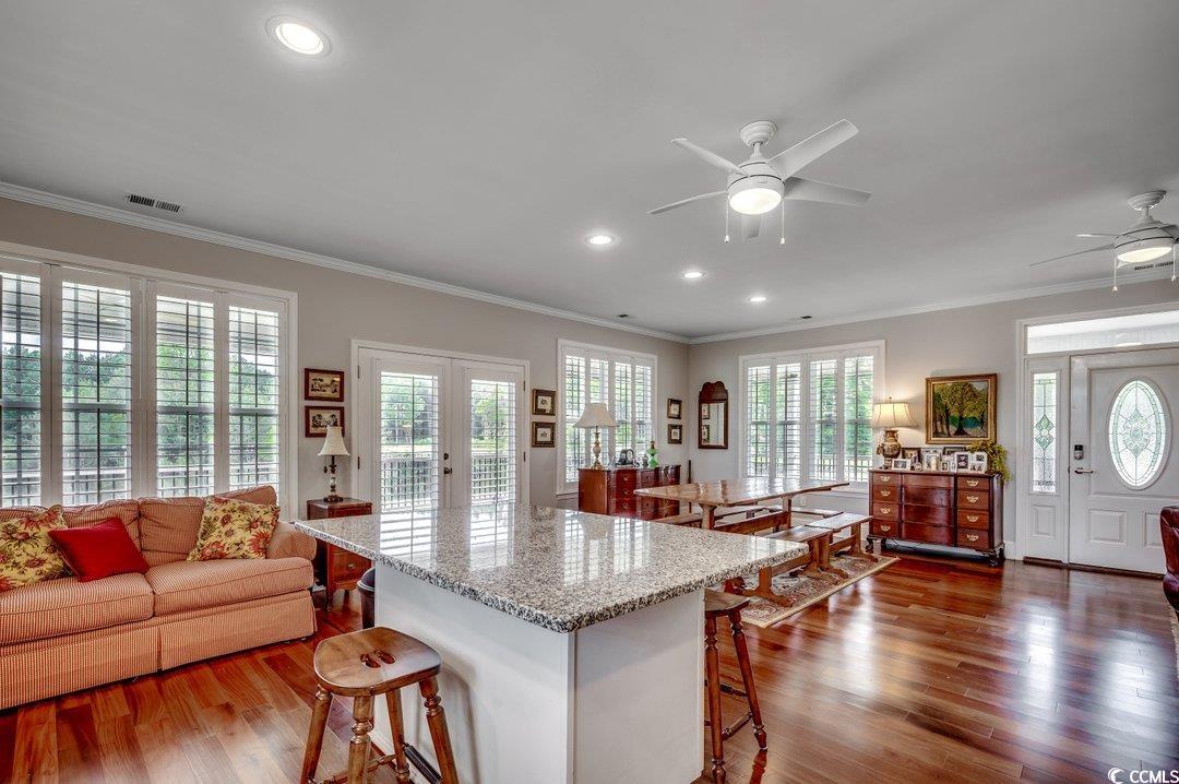 5517 Tranquil Road Conway, SC 29527 - Photo 10 of 39 Kitchen with ceiling fan, a kitchen bar, and a hea