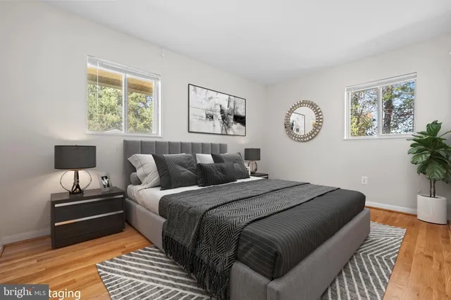 a bed room with a bed and a lamp