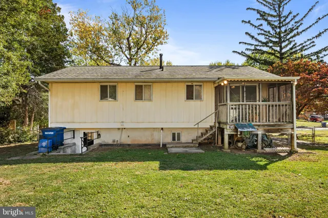 an aerial view of a house with swimming pool garden and patio