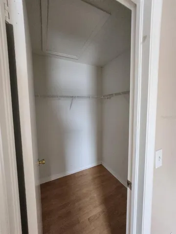 a bathroom with a granite countertop sink mirror and toilet