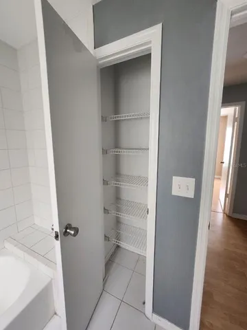 a bathroom with a bathtub and toilet