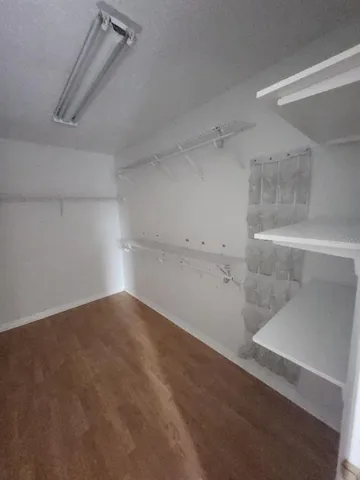 a view of house with a yard and sitting area