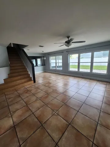 a view of an empty room with windows