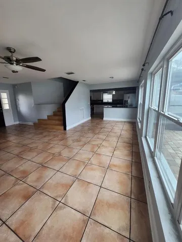 a kitchen with stainless steel appliances granite countertop a sink a stove and a microwave