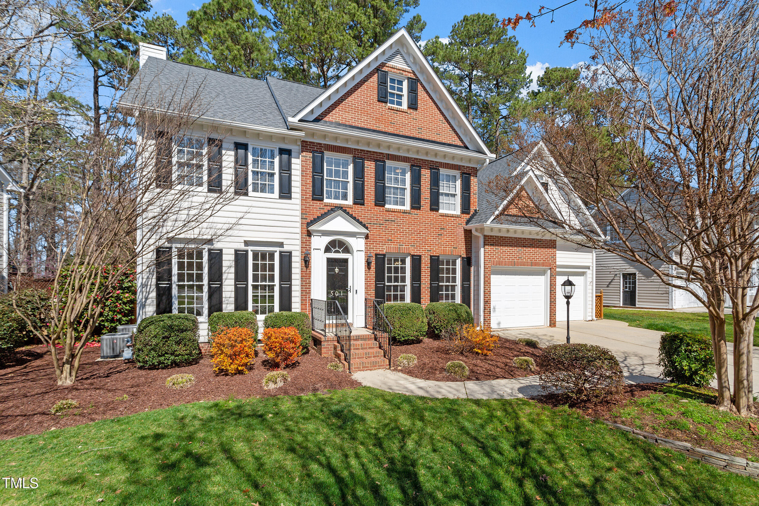 501 Nantucket Drive Cary, NC 27513 - Photo 1 of 34 a front view of a house with a yard and porch