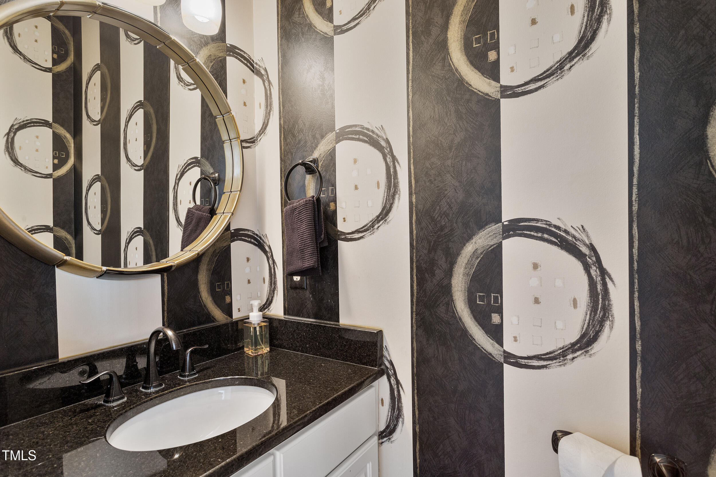 501 Nantucket Drive Cary, NC 27513 - Photo 18 of 34 a bathroom with a sink and a mirror