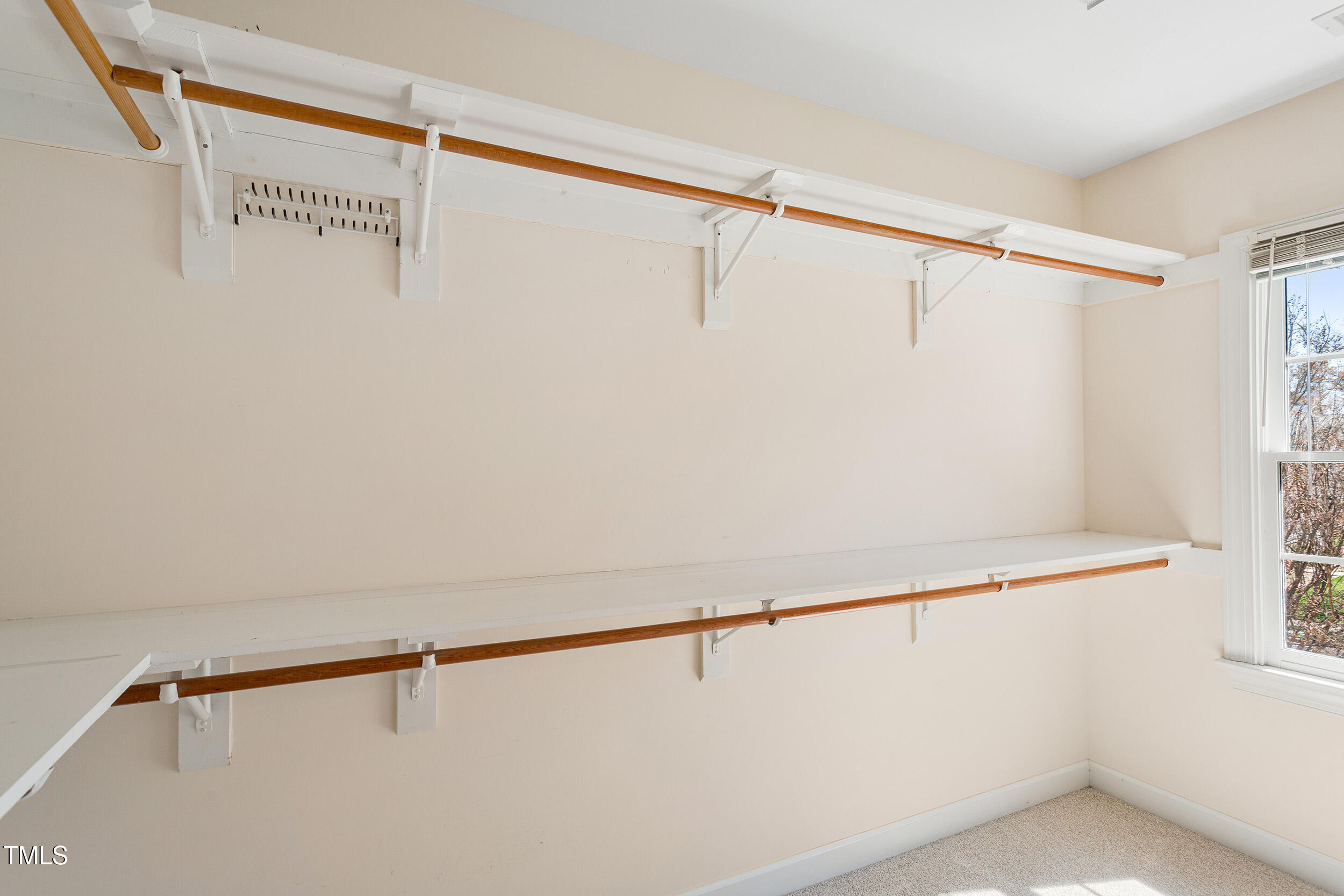 501 Nantucket Drive Cary, NC 27513 - Photo 21 of 34 a view of walk in closet with clothes