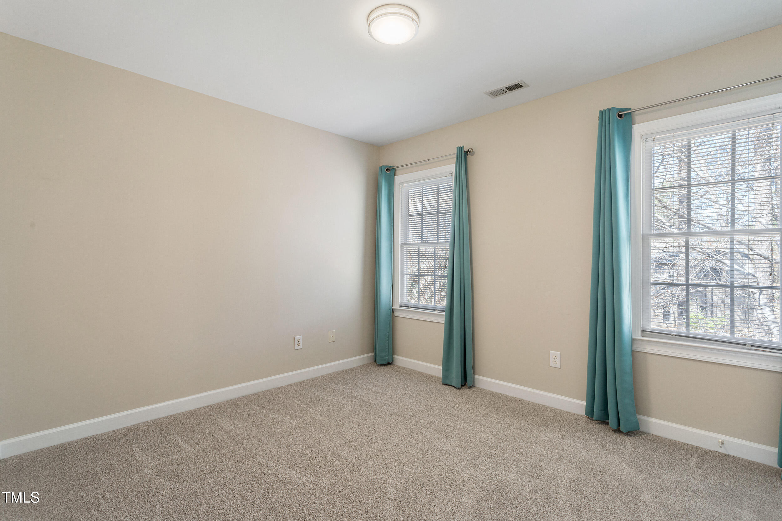 501 Nantucket Drive Cary, NC 27513 - Photo 25 of 34 an empty room with windows and closet
