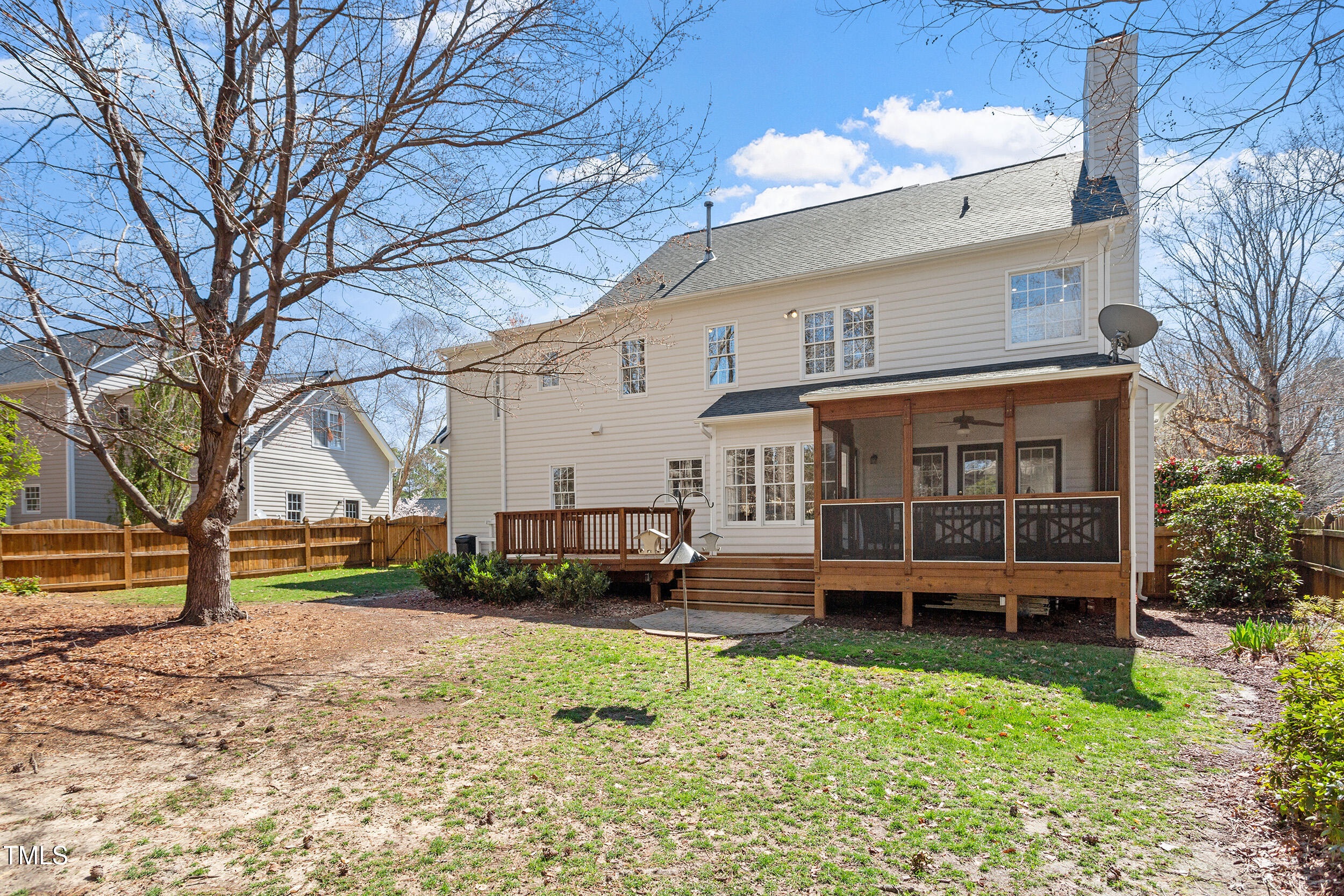 501 Nantucket Drive Cary, NC 27513 - Photo 30 of 34 a view of a house with a yard chairs and wooden fence