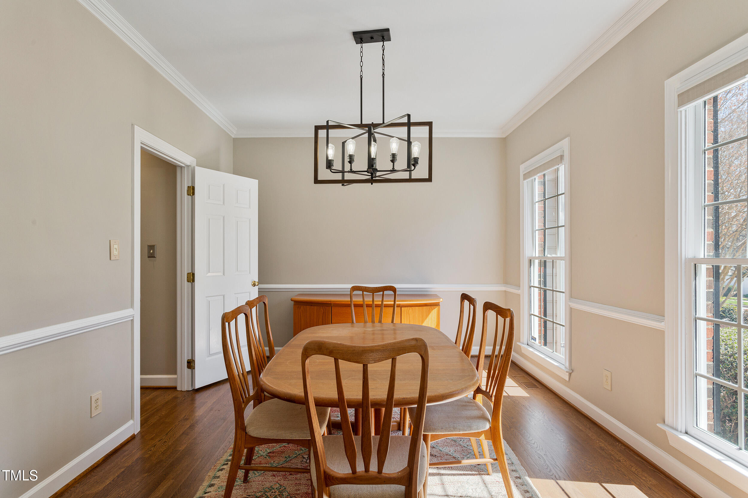 501 Nantucket Drive Cary, NC 27513 - Photo 3 of 34 a view of a dining room with furniture window and wooden floor