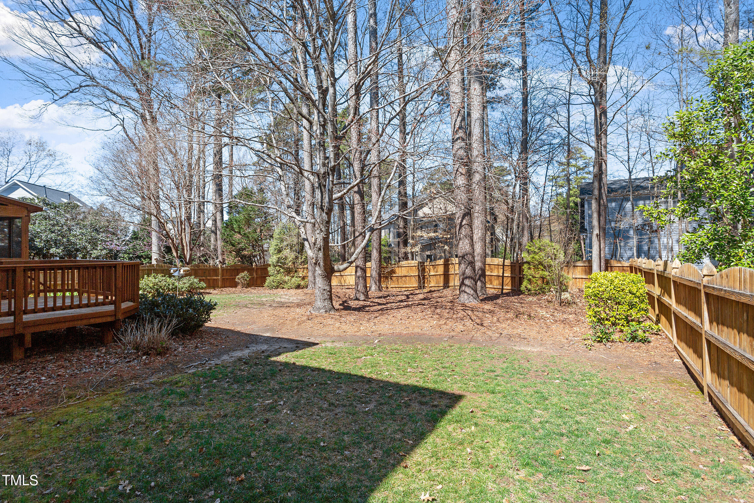 501 Nantucket Drive Cary, NC 27513 - Photo 34 of 34 a view of a yard with wooden fence