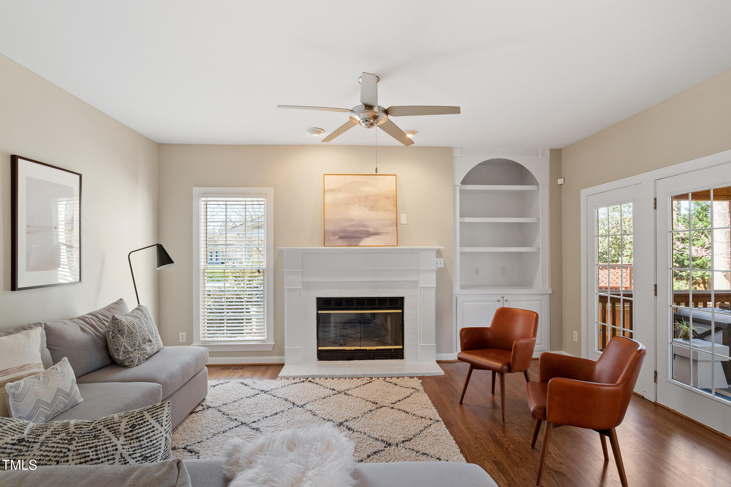 501 Nantucket Drive Cary, NC 27513 - Photo 6 of 34 a living room with furniture and a fireplace
