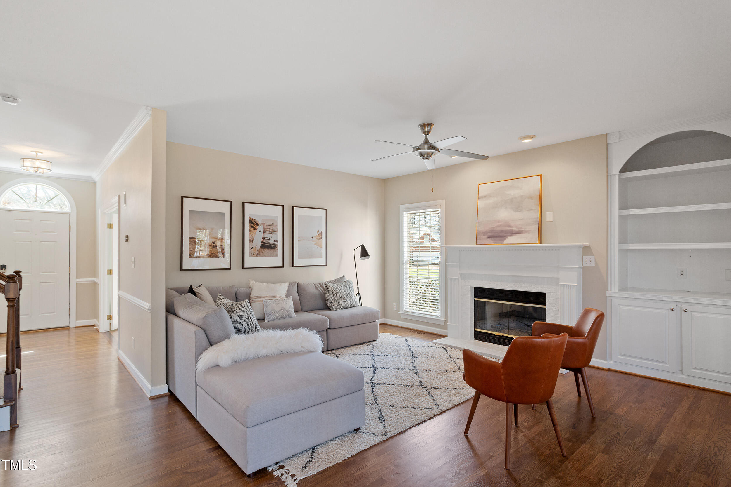 501 Nantucket Drive Cary, NC 27513 - Photo 7 of 34 a living room with furniture and a fireplace