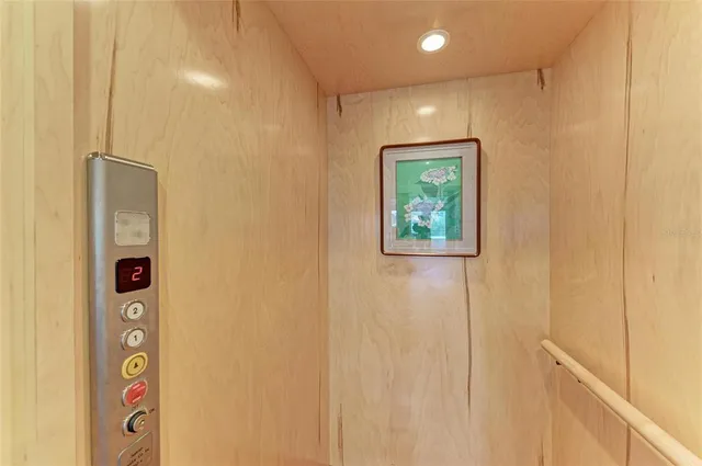 a view of a dining room with furniture wooden floor and chandelier