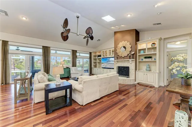 a large kitchen with a large counter top appliances and cabinets
