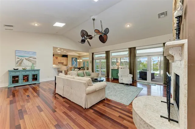 a kitchen with counter top space and windows