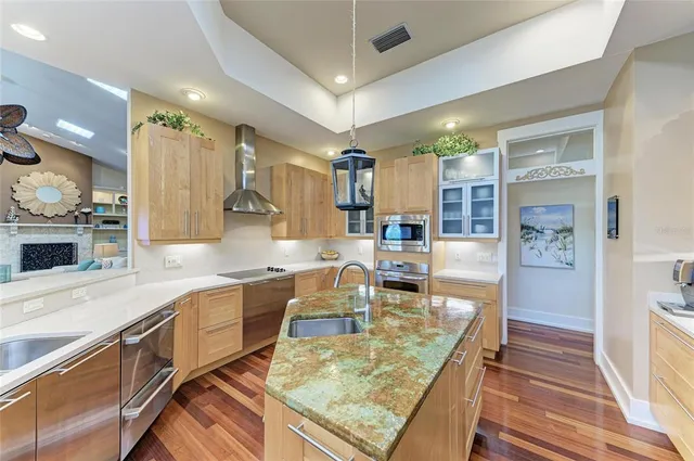 a kitchen with a sink cabinets and window