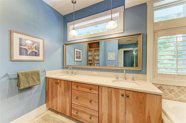 a bathroom with a bathtub and a shower