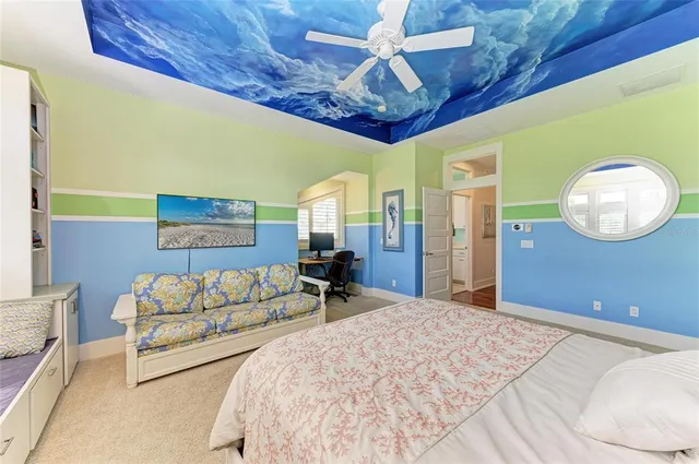 a view of a patio with a table chairs and a floor to ceiling window