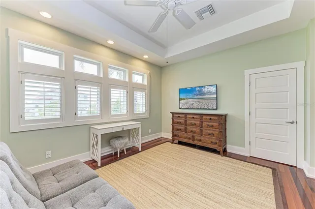 a view of a backyard with a tree