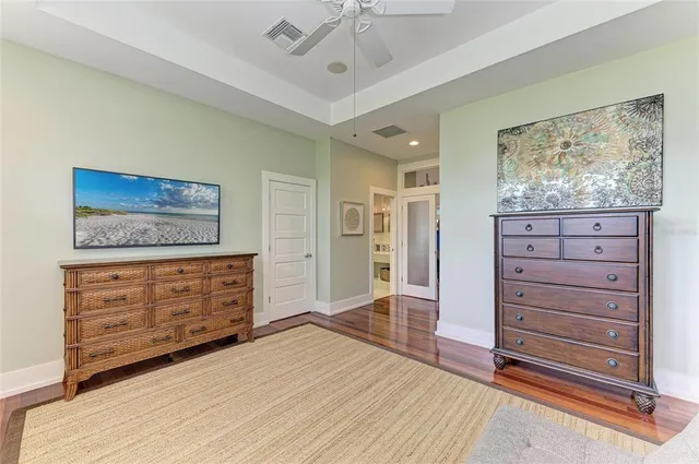 a view of a patio with table and chairs potted plants with palm trees