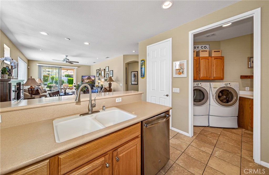1760 Scottsdale Road Beaumont, CA 92223 - Photo 9 of 37 BREAKFAST BAR, SERVING COUNTER. VIEW TOWARDS LAUNDRY ROOM