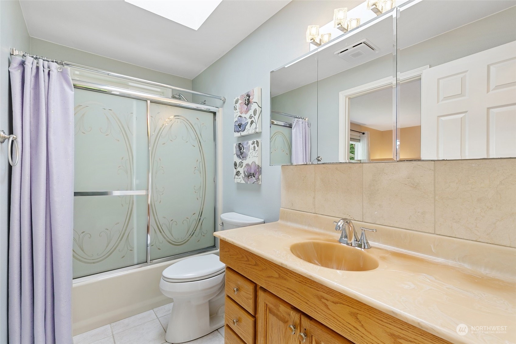5409 Seahurst Avenue Everett, WA 98203 - Photo 19 of 26 a bathroom with a sink a toilet and shower
